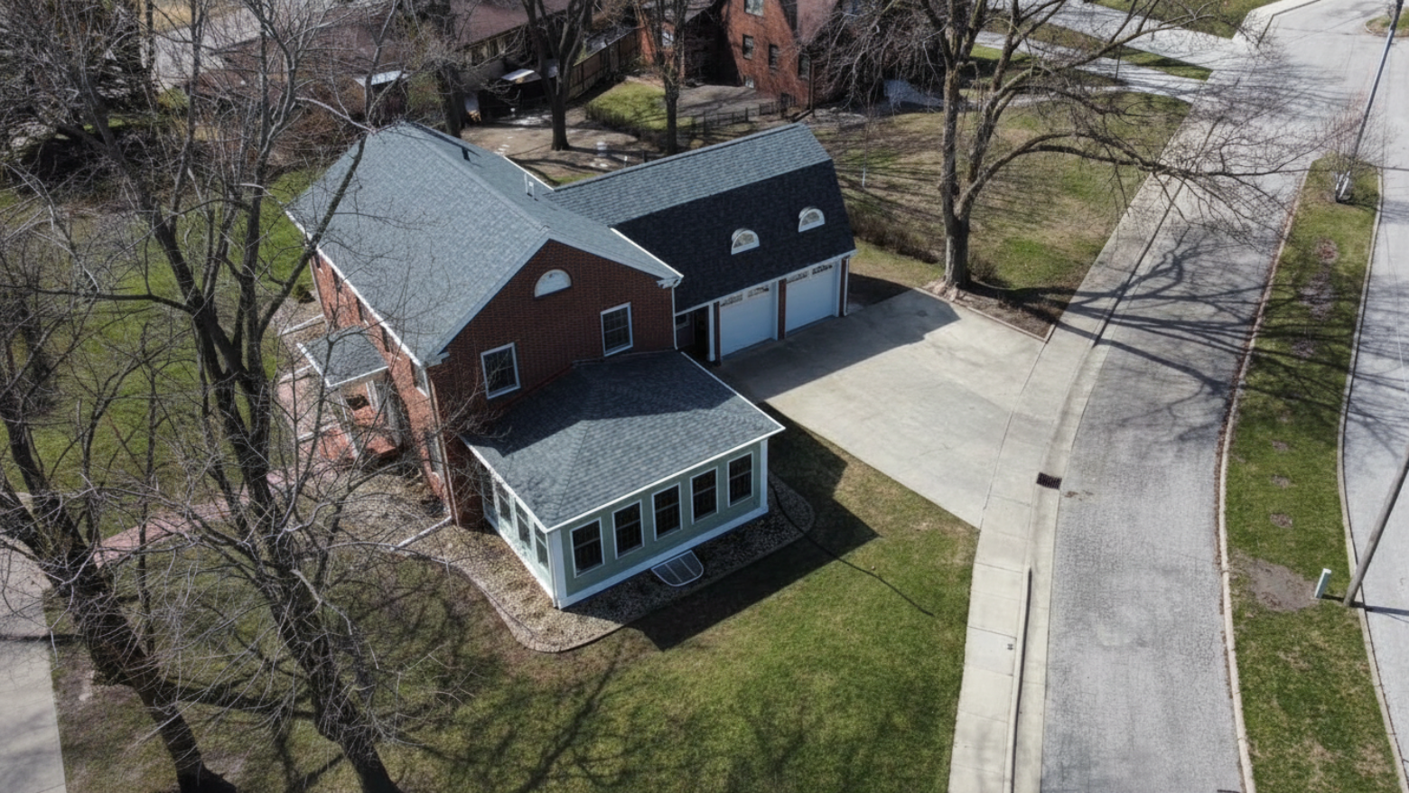 Aerial drone view of a modern Iowa home at golden hour